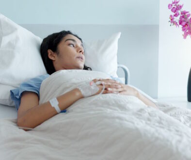 Hospital bed, woman and stress with thinking about medical support and surgery at a clinic. Anxiety, sad and tired female patient with recovery and healthcare treatment in a ICU room of sick person